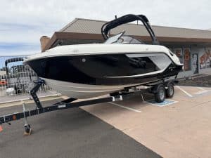 Luxury black and white speedboat on trailer, ideal for water sports and leisure. Perfect for boating.