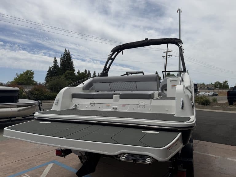 Opti boat rear view with swim platform and seating area.