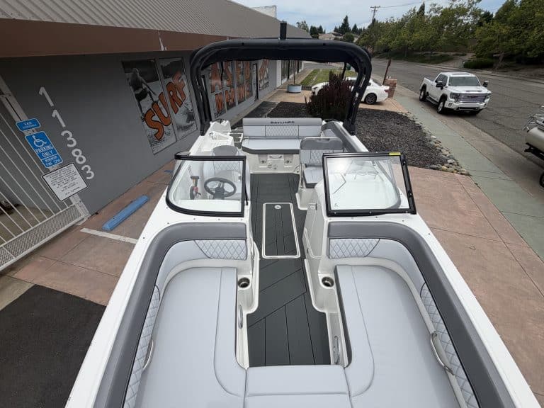 Recreational boat interior with comfortable seating, steering console, and modern design for marine.