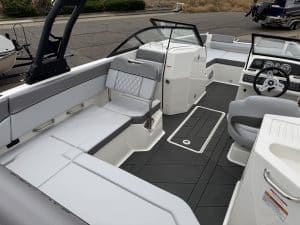 Luxury boat cockpit with modern controls and seating.