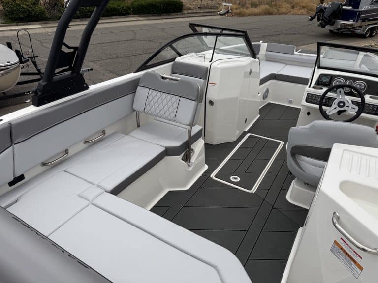 Luxury boat cockpit with modern controls and seating.