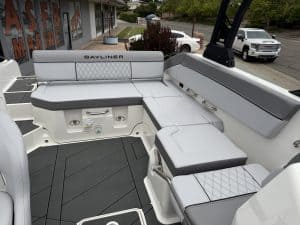Modern Bayliner boat interior with comfortable seating for leisure and fishing.