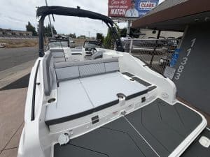 Boat with a spacious deck and seating area for leisure and water activities.