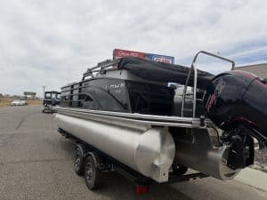 Pontoon boat with powerful outboard motor, ideal for recreational boating and water adventures.