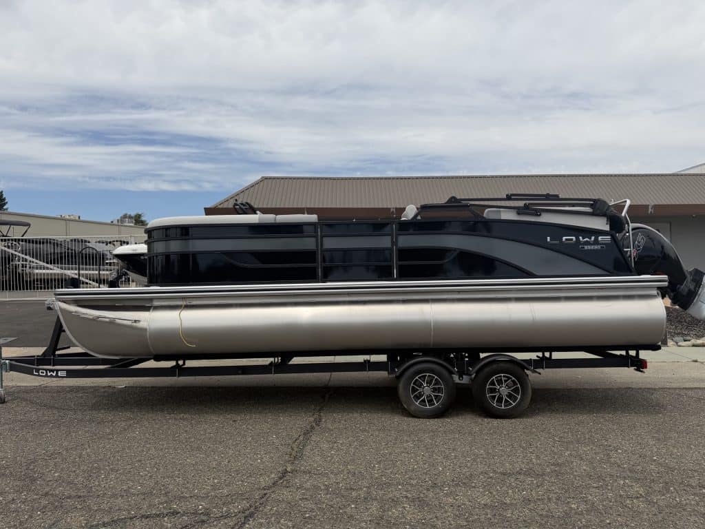 Modern Lowe pontoon boat on trailer at ASFB Marine dealership.