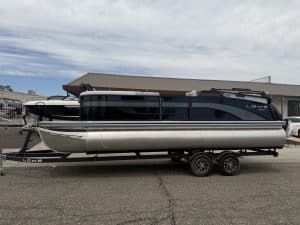 Luxury pontoon boat on trailer at ASFB Marine for Opti boat rentals and sales.