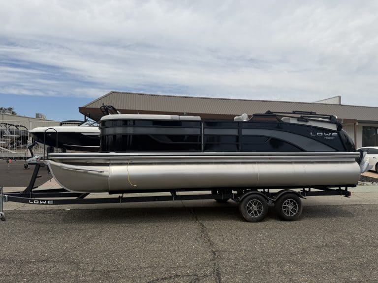 Luxury pontoon boat on trailer at ASFB Marine for Opti boat rentals and sales.