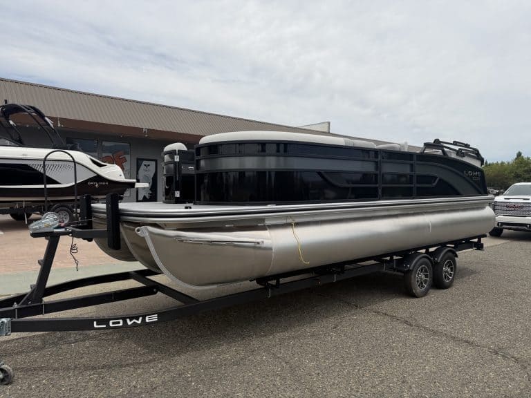 Luxury pontoon boat on trailer for sale at ASFB Marine dealership.