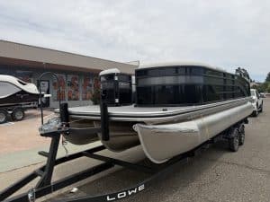 Luxury pontoon boat with sleek black design, perfect for leisure and water adventures.