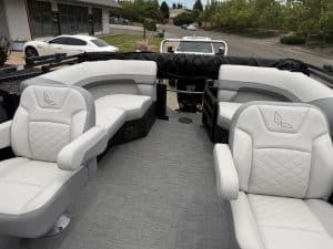 Luxury boat seating with plush white cushions and ergonomic design for enhanced comfort on the water.