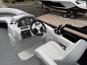 Helm station featuring advanced navigation and control systems on a sleek boat. Perfect for optimal.