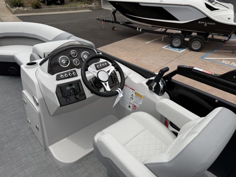 Helm station featuring advanced navigation and control systems on a sleek boat. Perfect for optimal.