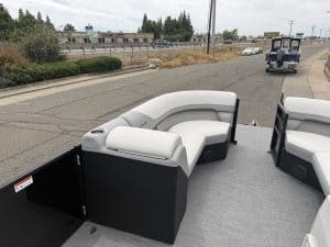 Luxury boat seating with comfortable white cushions and stylish black trim.