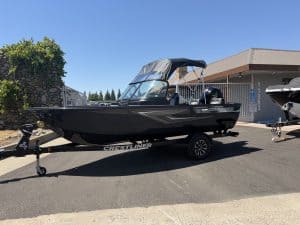 Crestliner 1850 Kodiak boat with Mercury 115HP engine on trailer.