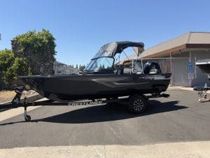 Crestliner 1850 Kodiak boat with Mercury 115HP engine on trailer.