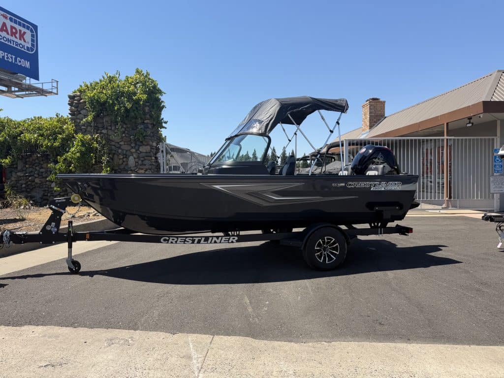 2026 Crestliner 1850 Kodiak boat with Mercury 115HP engine on trailer.