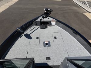 Boat deck with trolling motor and electronics for fishing or boating.