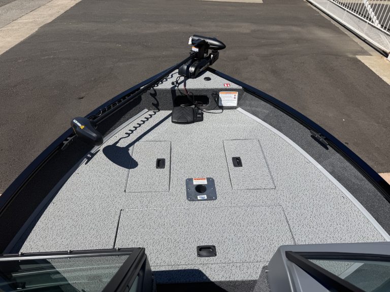 Boat deck with trolling motor and electronics for fishing or boating.