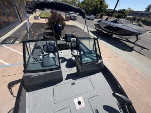 Modern boat with dual steering stations and canopy at ASFB Marine.