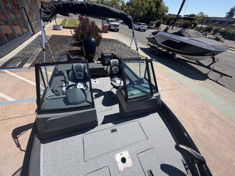 Modern boat with dual steering stations and canopy at ASFB Marine.