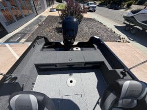 Lowe boat with Mercury 90HP outboard motor at dealership.