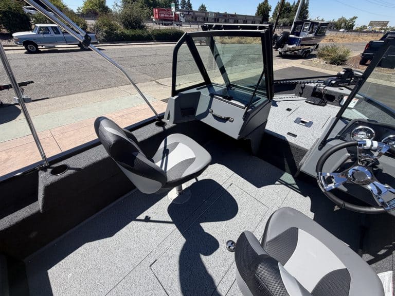 Boat helm station with steering wheel and controls on Lowe FM 1625 WT.