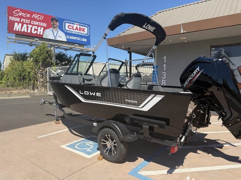 Lowe FM 1625 WT boat with Mercury 90HP outboard motor on trailer.