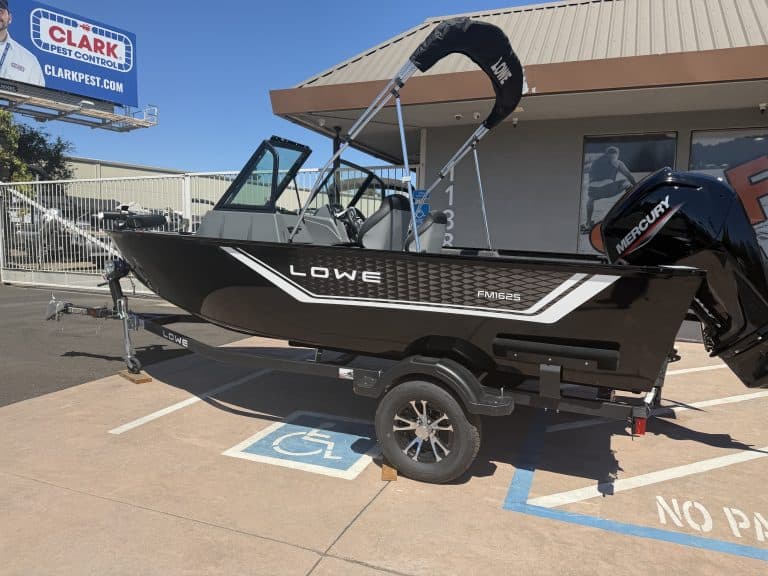 Lowe FM 1625 WT fishing boat with Mercury 90HP outboard motor on trailer.