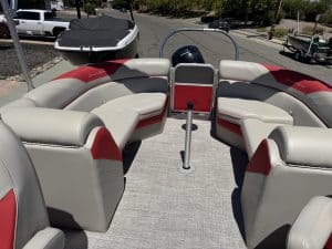 Pontoon boat with seating and Mercury 150HP engine for sale.