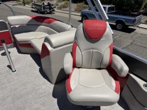 Boat seating with red and white upholstery on a South Bay LE 22FT boat.
