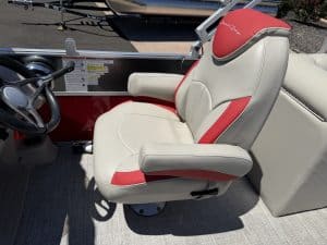 Comfortable boat seat with red and white upholstery for marine vessel.