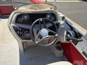 Boat dashboard with gauges and steering wheel for South Bay LE 22FT.