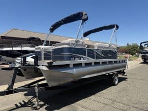 Pontoon boat on trailer with canopy at ASFB Marine.