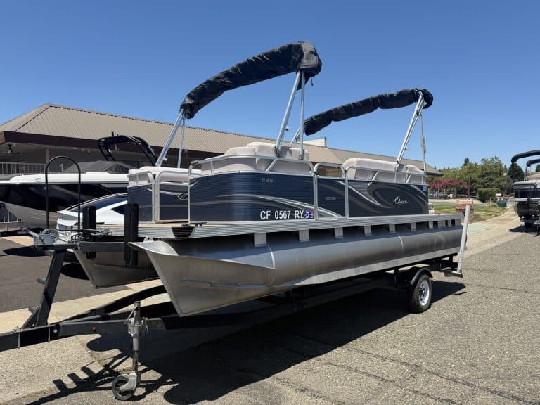 Pontoon boat on trailer with canopy at ASFB Marine.