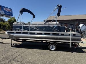 Pontoon boat on trailer at ASFB Marine with new branding.