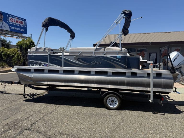 Pontoon boat on trailer at ASFB Marine with new branding.
