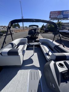 Bennington 22FT SwingBack pontoon boat with Mercury 200HP engine on display.