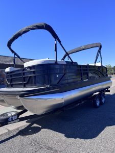 Bennington 22FT SwingBack pontoon boat with Mercury 200HP engine on trailer.