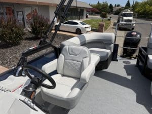 Close-up of boat captain's seat and dashboard on a boat.