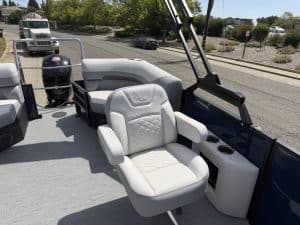 Luxury boat interior with white seating and dashboard features.