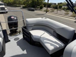 Comfortable boat seating with Mercury outboard engine in the background.