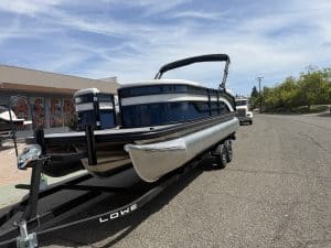 Lowe SS 230 WV boat with Mercury 150HP engine on trailer.