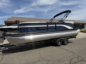 Lowe SS 230 WV pontoon boat with Mercury 150HP engine on trailer.
