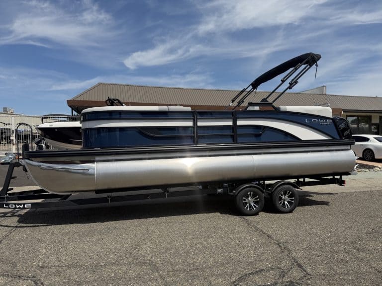 Lowe SS 230 WV pontoon boat with Mercury 150HP engine on trailer.