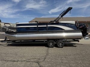 Lowe SS 230 WV pontoon boat with Mercury 150HP engine on trailer.