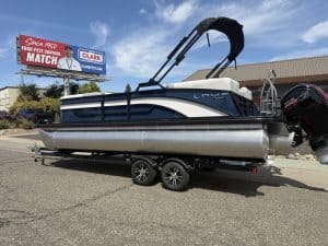 Lowe SS 230 WV pontoon boat with Mercury 150HP engine on trailer.