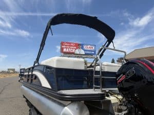 Lowe SS 230 WV pontoon boat with Mercury 150HP engine on display.