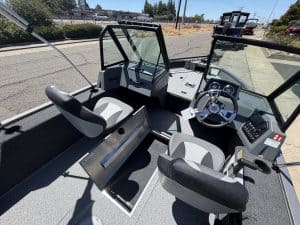 Interior view of Lowe FM 1625 WT boat with steering and seating.