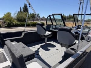 Interior view of Lowe FM 1625 WT boat with steering and seating.