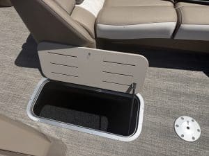 Storage compartment under boat seat with hatch open, marine seating.